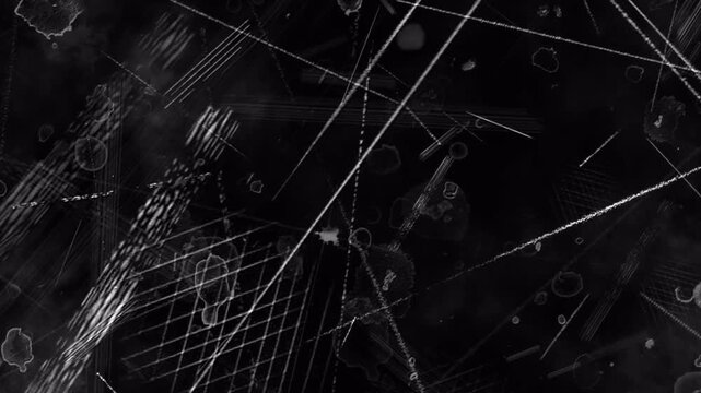 Abstract dark background with crossing light streaks and particle dust.