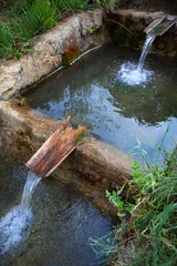 Rustic waterway conduit made of stone and tile © Redzen