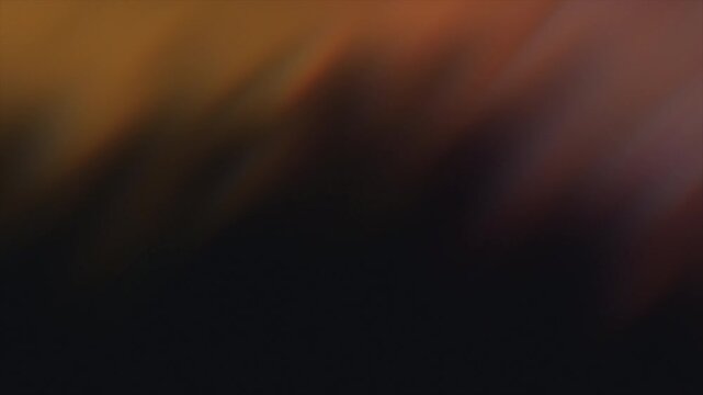 Abstract dark background with shifting blurred light and motion.