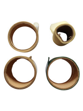 Four ancient circular artifacts displaying natural materials worn texture and primitive design antique tribal rings transparent background