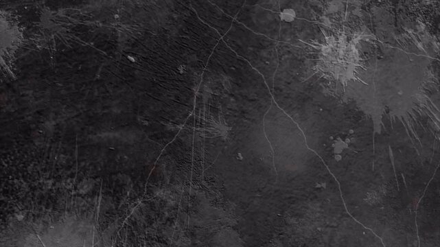 Abstract dark charcoal grey grunge background with subtle light particles.