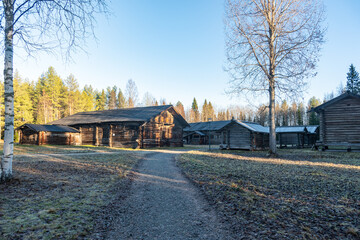 Fototapeta premium Traditional russian log house in rural village landscape