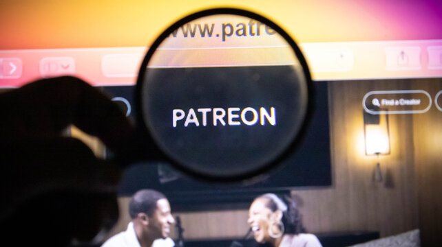 Magnifying glass focused on the patreon logo on a computer screen