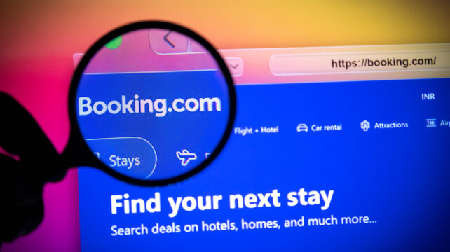 Magnifying glass over the bookingcom website on a computer screen