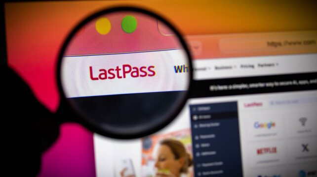 Magnifying glass focused on the lastpass password manager website logo on a computer screen