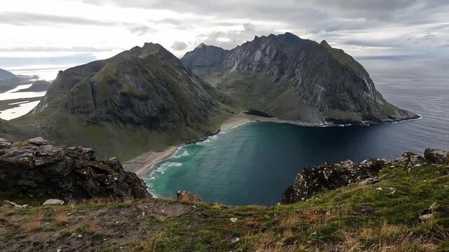 Panoramic Aerial View of Kvalvika Beach and Rocky Peaks from Ryten, Lofoten Islands Norway