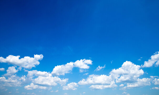 Blue sky background with a tiny clouds