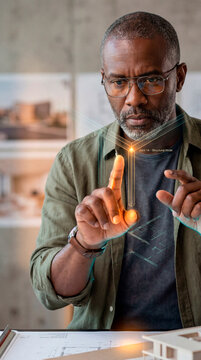 Focused Architect Manipulating Holographic Structural Wireframe