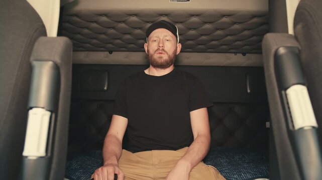 Stressed truck driver threatening with a key in a sleeper cab