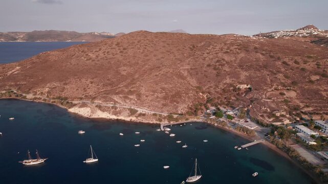 Aerial view of secluded bay with sailboats near Parikia in Paros Island Greece