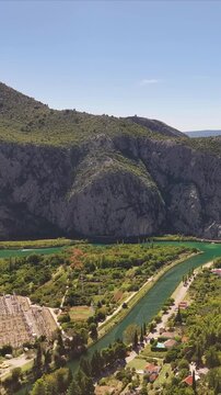 Mountain view above Omi&scaron; featuring Mila Gojsalic monument and landscape.