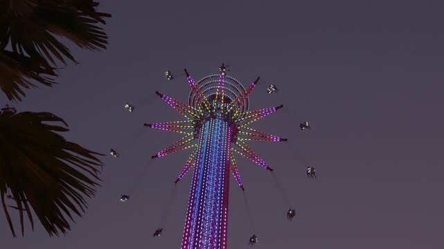 Colorful Skyflyer Ride Spinning Above The Chao Phraya River In Bangkok, Thailand At Dusk