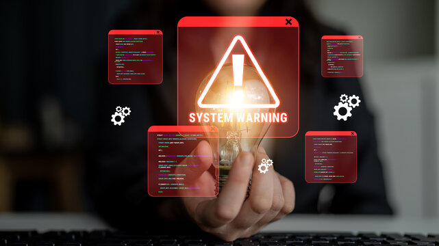 Electronic circuit with system warning alert, computer code snippets on screen, technology safety issues, cybersecurity alert, glowing light bulb concept Haptic.