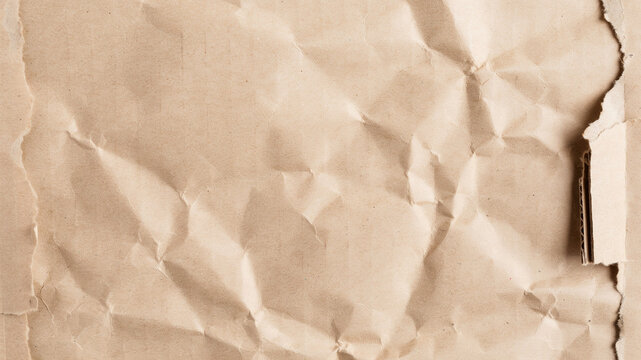 Crumpled brown paper texture, vintage wrinkled cardboard background with torn edges, rustic tan craft paper surface for scrapbooking and design