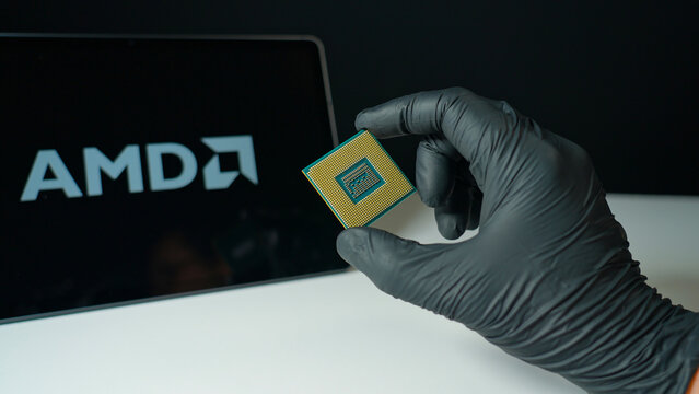 Advanced Micro Devices AMD background display, American semiconductor company, designs high-performance CPUs, GPUs, FPGAs, and adaptive computing solutions : Toronto, Ontario, Canada - May 9, 2026