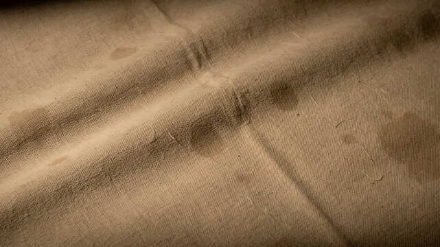 Wrinkled brown fabric texture, close-up, leather or suede material, seamless pattern