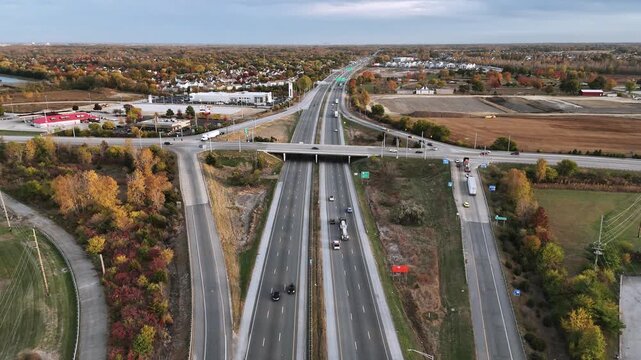 Drone perspective of multi lane highway with moderate car traffic