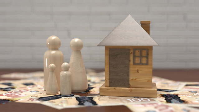 Wooden peg doll family and model house on top of Canadian dollar banknotes