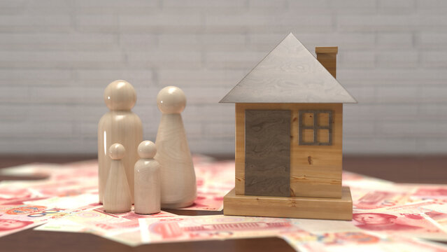 Wooden peg doll family and model house on top of Chinese yuan banknotes