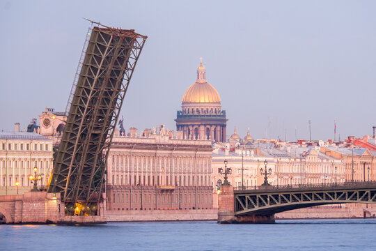 Raised Span of Trinity Bridge during White Nights in Saint Petersburg with Saint Isaac Cathedral in Background