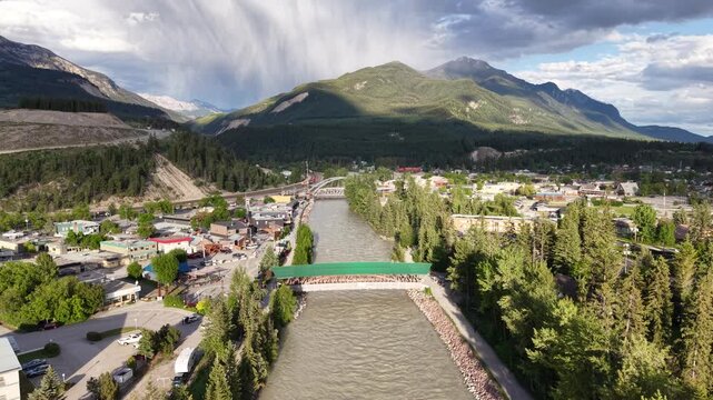 Aerial View of Golden Town with Green Bridge over Kicking Horse River and Mountain Valley, BC Canada