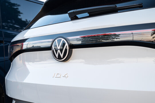 Wolfsburg, Germany, 21 May 2026: Closeup of white Volkswagen ID.4 electric car rear badge and VW logo (emblem)