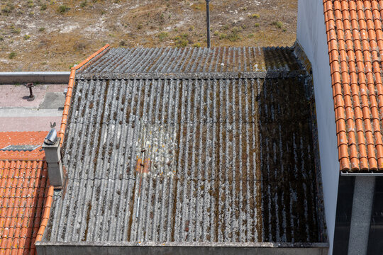 Old corrugated roof with dangerous asbestos material