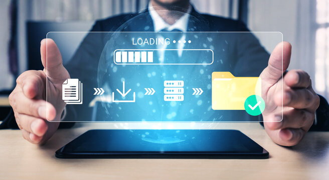 Businessman using digital tablet to manage data transfer and download process with modern technology and holographic interface in office environment. Glyphic.