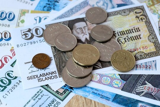 Icelandic krona money bills and coins on table. Iceland cash of ISK currency close up