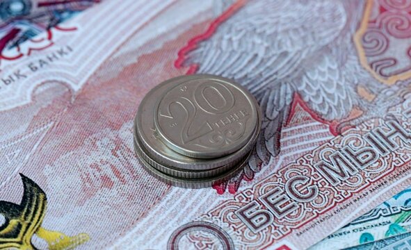 Kazakhstani tenge money bills and coins on table. Kazakhstan cash of KZT currency