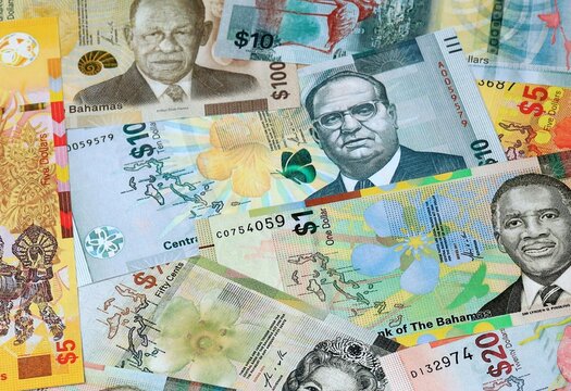 Bahamian dollar money banknotes bunch on table. Bahamas bills of BSD currency close up