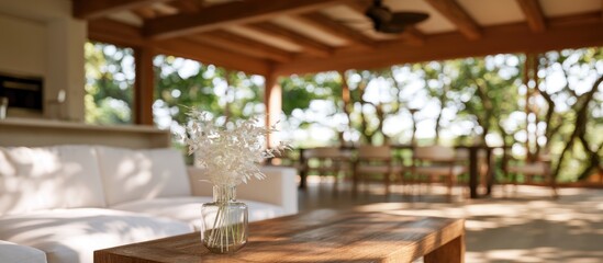 Fototapeta premium Rustic outdoor living area with a sofa, coffee table, and dining set