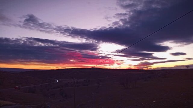 Cinematic sunset sky over rural nature landscape of Mesopotamia on the road to Diyarbakir