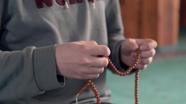 Young muslim man praying
