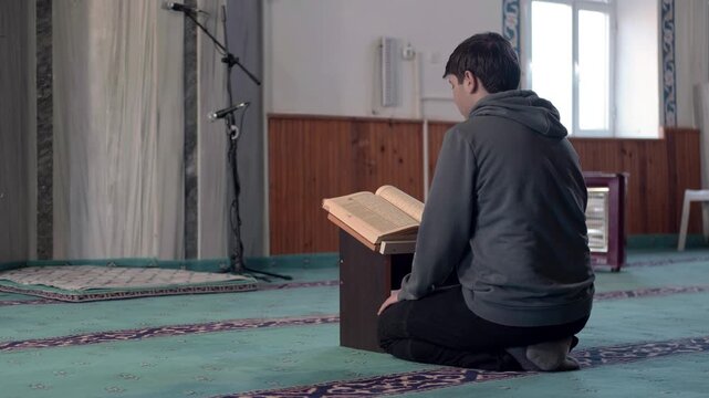 Muslim reading Quran masjid