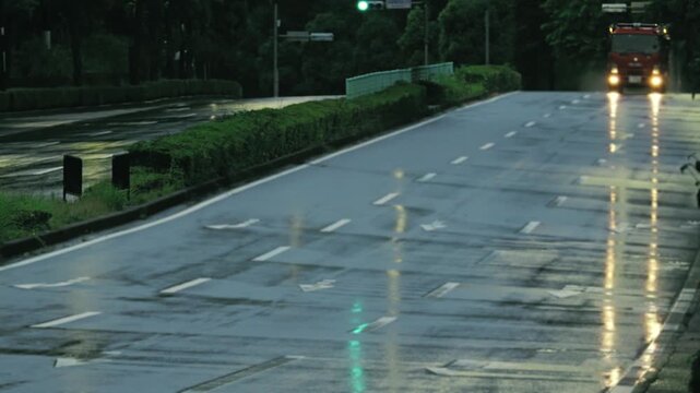 Tokyo, Japan - June 27, 2026: A fire engine running on a rainy street at dawn