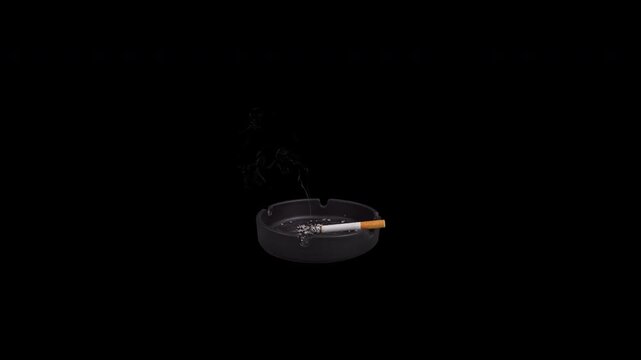 Filter cigarette in a black ashtray