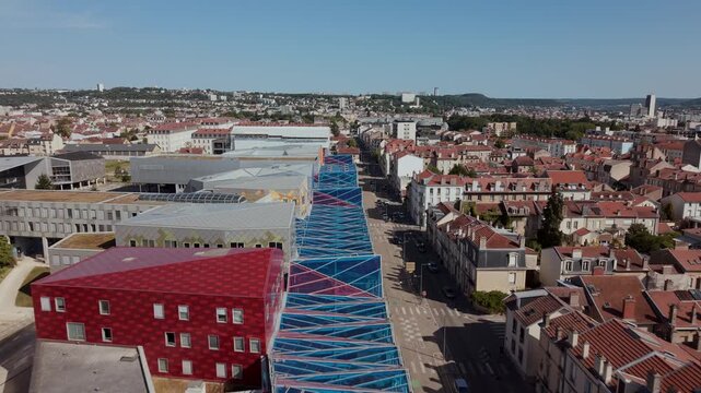 High-Angle Aerial Drone Shot of the Modern Artem Campus with Colorful Architectural Facades and Signature Glass Gallery in Nancy Under a Clear Blue Sky (2)
