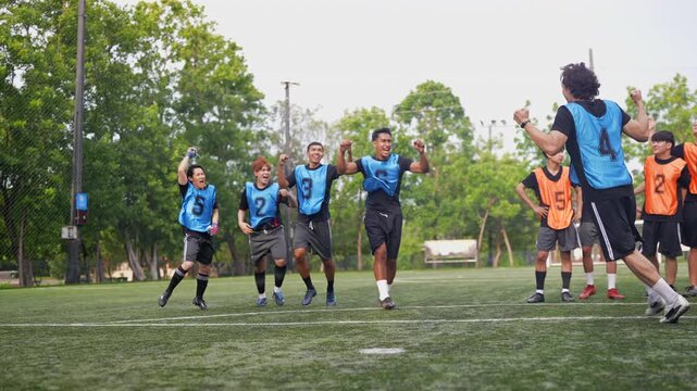 Victorious soccer players embrace and celebrate after converting a decisive penalty, while opposing athletes react with disappointment, highlighting teamwork, resilience, determination, athletic excel