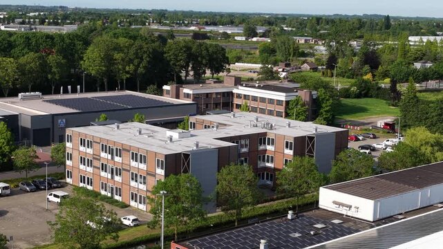 Aerial drone view of prefabricated modular housing, showing temporary homes, off-site construction, transportable units and flexible residential development.
