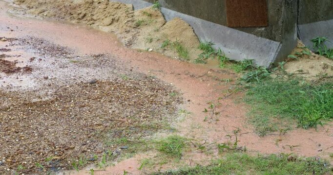 Heavy rainfall causing localized flooding and water pooling across a natural landscape. Highlighting the raw power of nature, extreme weather conditions, and environmental climate impact.