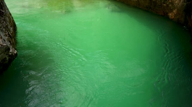 Reveal of Turquoise Water Flowing Through the Great Soca Gorge Limestone Canyon in Slovenia
