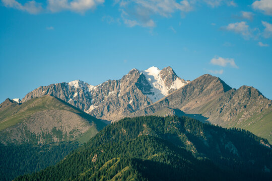 Snow peaks and forest hills of Tianshan Mountains, Xinjiang China