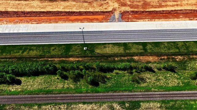Aerial view of railway construction showing parallel tracks and earthworks in progress