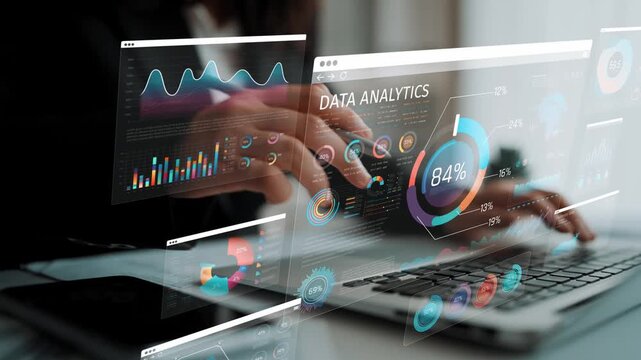 Business professional working on data analytics project with multiple visualizations and graphs on modern computer screen in a collaborative environment Sigmoid