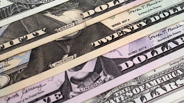 Top view 4K video close up. USA cash money background. 100, 50, 20, 5 dollars bill. USD. Set of American paper banknotes. Concept of pay tax, debt, loan, credit, salary, in god we trust, budget, bank
