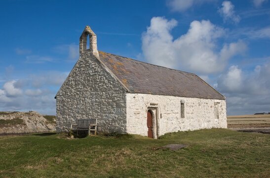 Cwyfan church, Llangadwaladr, Anglesey, Wales. The historic 12th-century medieval church, also known as St Cwyfan's or the 'Church in the Sea', sits isolated on the tidal island of Cribinau.