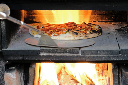 Home made pizzas on a wood fired oven