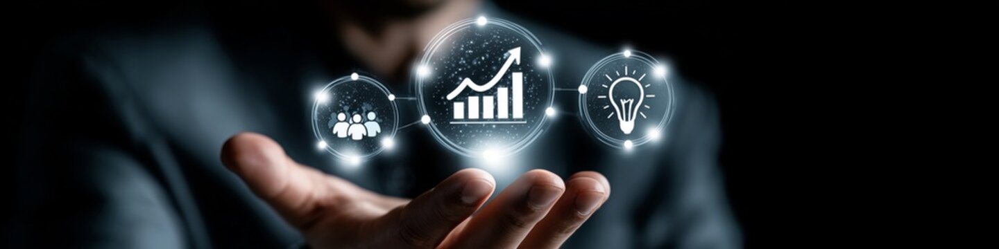Businessman displays a floating holographic dashboard with team and profit chart icons hovering over his hand to illustrate effective resource management and organizational growth within a company.