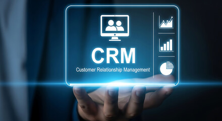 Fototapeta premium A business person touching a digital hologram screen displaying crm customer relationship management software concept